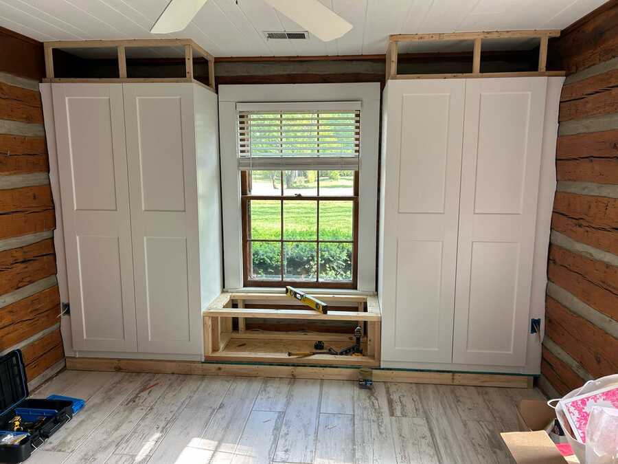 Built-in cabinet project with bench framing in progress